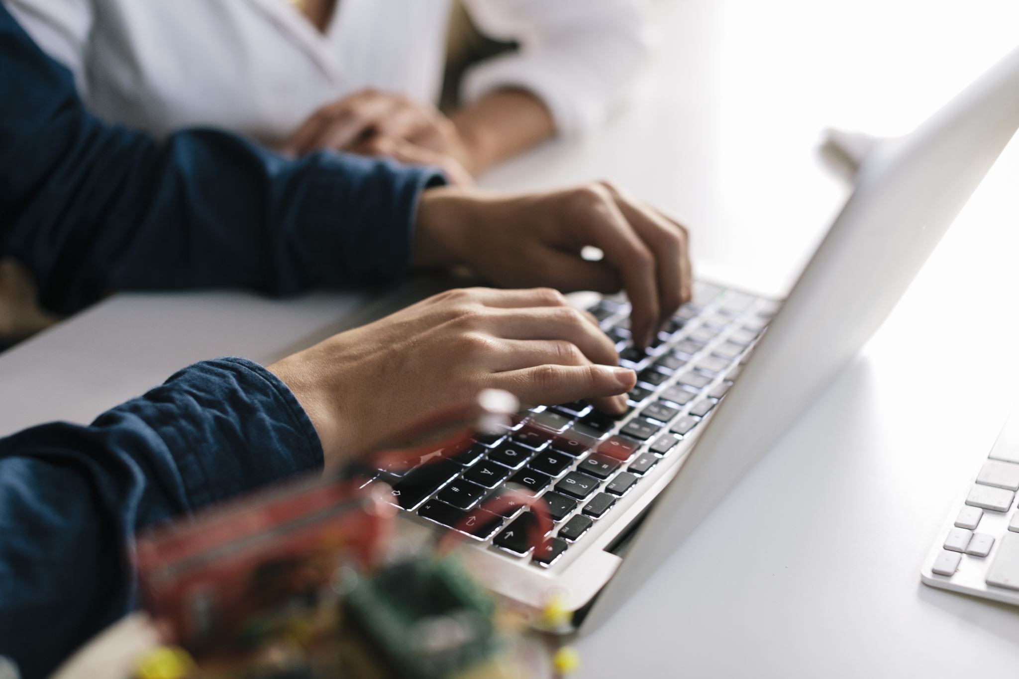 Person-typing-on-laptop